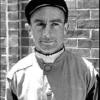Jockey, Ted Atkinson guided Capot 
to a new track record at the 
1949 Preakness Stakes.
